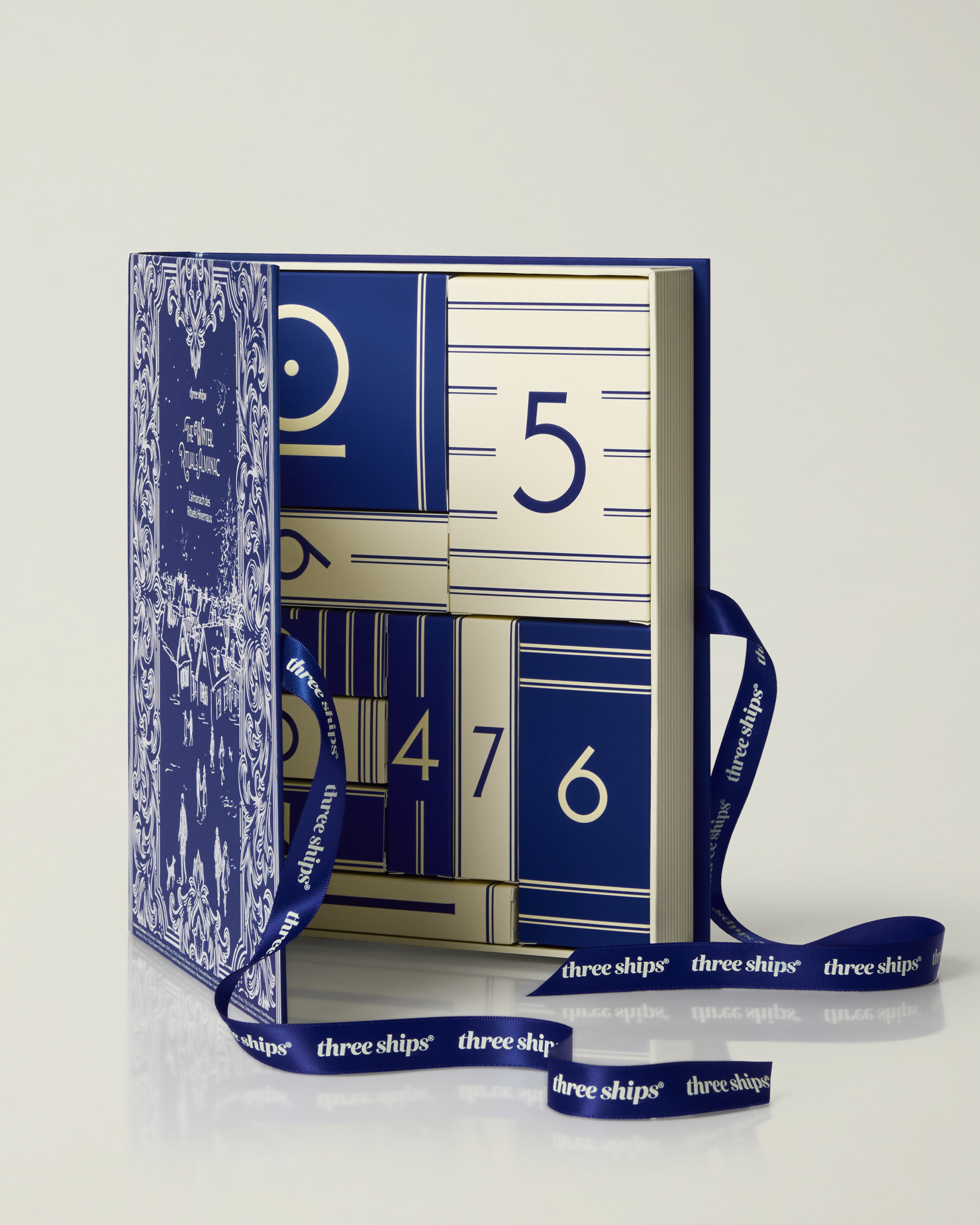 Three Ships-The Winter Rituals Almanac Three Ships Holiday Advent Calendar-Skincare-990478500600_TheWinterRitualsAlmanacThreeShipsHolidayAdventCalendar__Front-BoxOpen_f0ed4292-b8bf-4dca-9232-44d9d422740d-The Detox Market | 