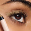 ILIA-Thru Line Waterproof Eyeliner-Makeup-ILIATHRULINEEYELINER_2026_MODEL_PORTRAIT_DEEP_1500x2000_07429de3-aef3-43ae-bc1d-10a6bf7c8d96-The Detox Market | Portrait - Antique gold shimmer