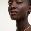 Wonderblush-La Laque Tinted Lip Oil-Makeup-LaLaque-ModelDarkSkin-Abricot-The Detox Market | Abricot - Muted peach