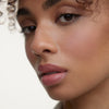 Wonderblush-Le Baume Tinted Lip Balm-Makeup-LeBaume-ModelMediumSkin-Petale-The Detox Market | Petale - Petal Pink