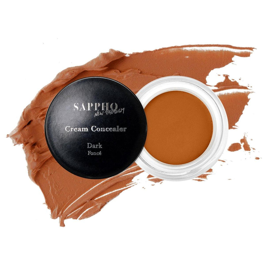 Sappho New Paradigm-New Paradigm Concealer-Makeup-Full_coverage_natural_concealer_for_Dark_skin_tone_open_jar_with_swatch_white_background-The Detox Market | Dark